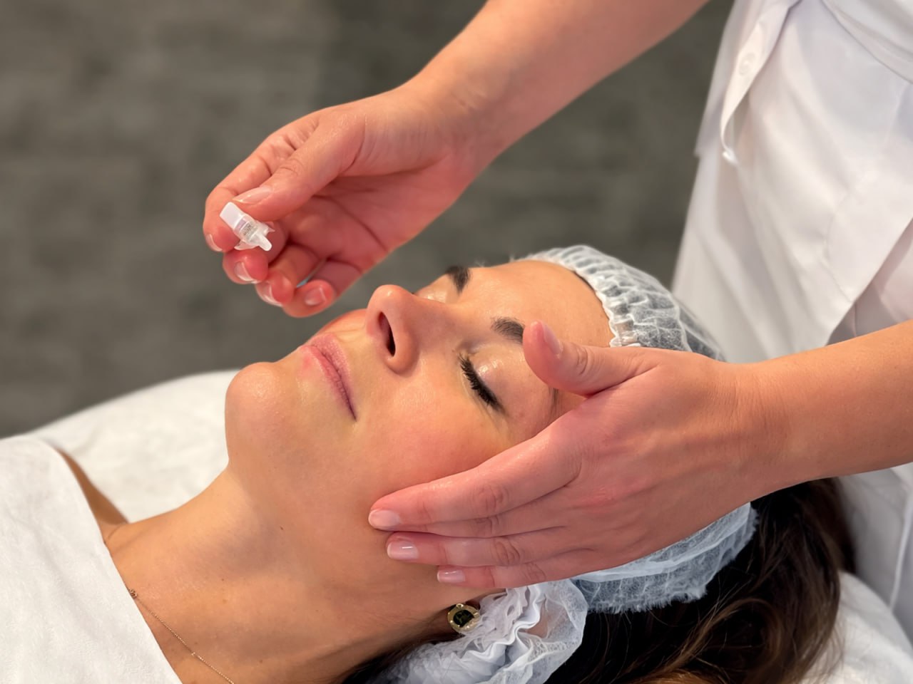 Professional cosmetic procedure on patient face